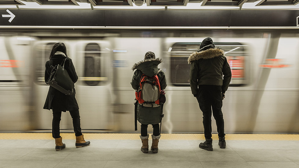 a person standing on a subway train