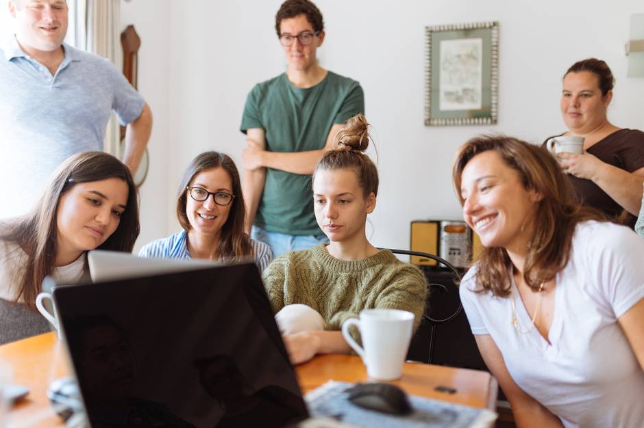 a group of people sitting at a table