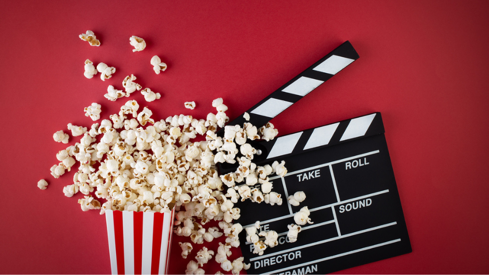 some popcorn next to a clapper board