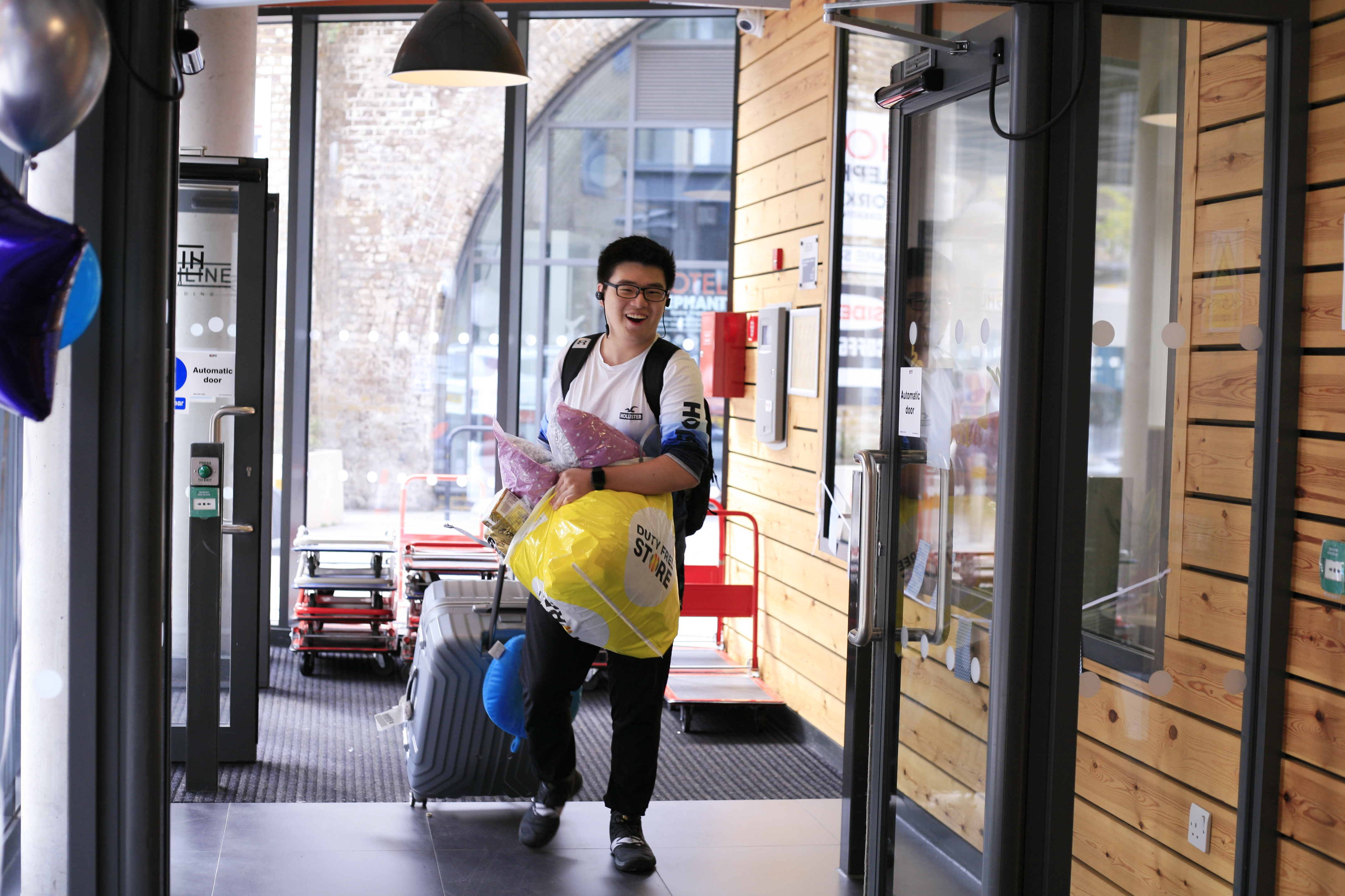 a student carrying his luggage