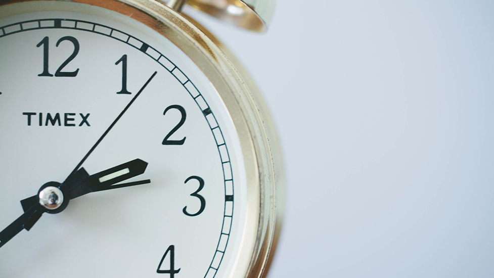 a close up of a clock in the middle of a watch