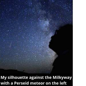 a silhouette by the milkyway