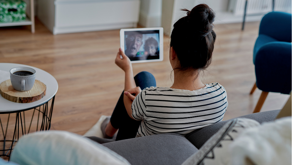 a person on a video call to their grandparents