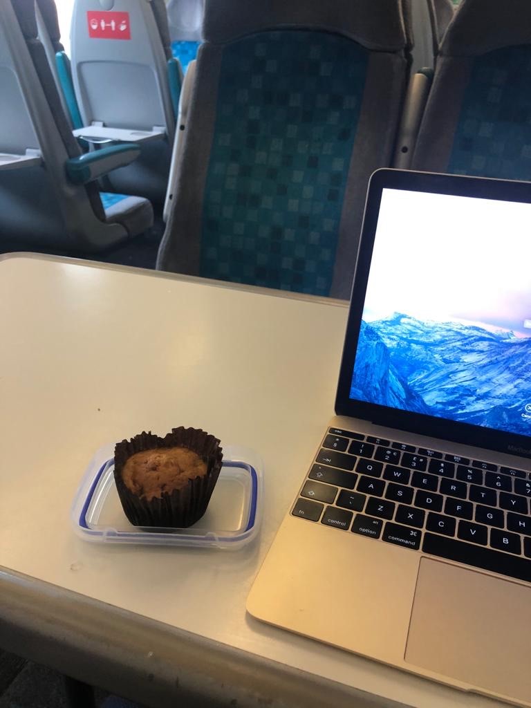 an open laptop computer sitting on top of a table