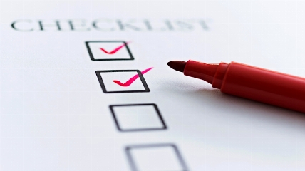 a checklist and a red pen