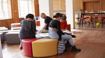 a group of people sitting at a table