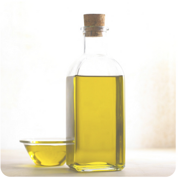 a close up of a bottle of olive oil