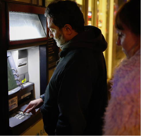 a man standing in front of a television