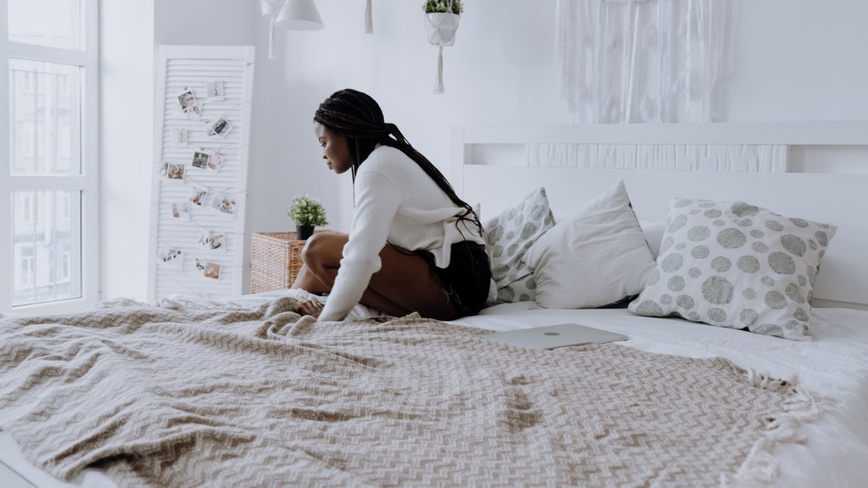 a person sitting on a bed