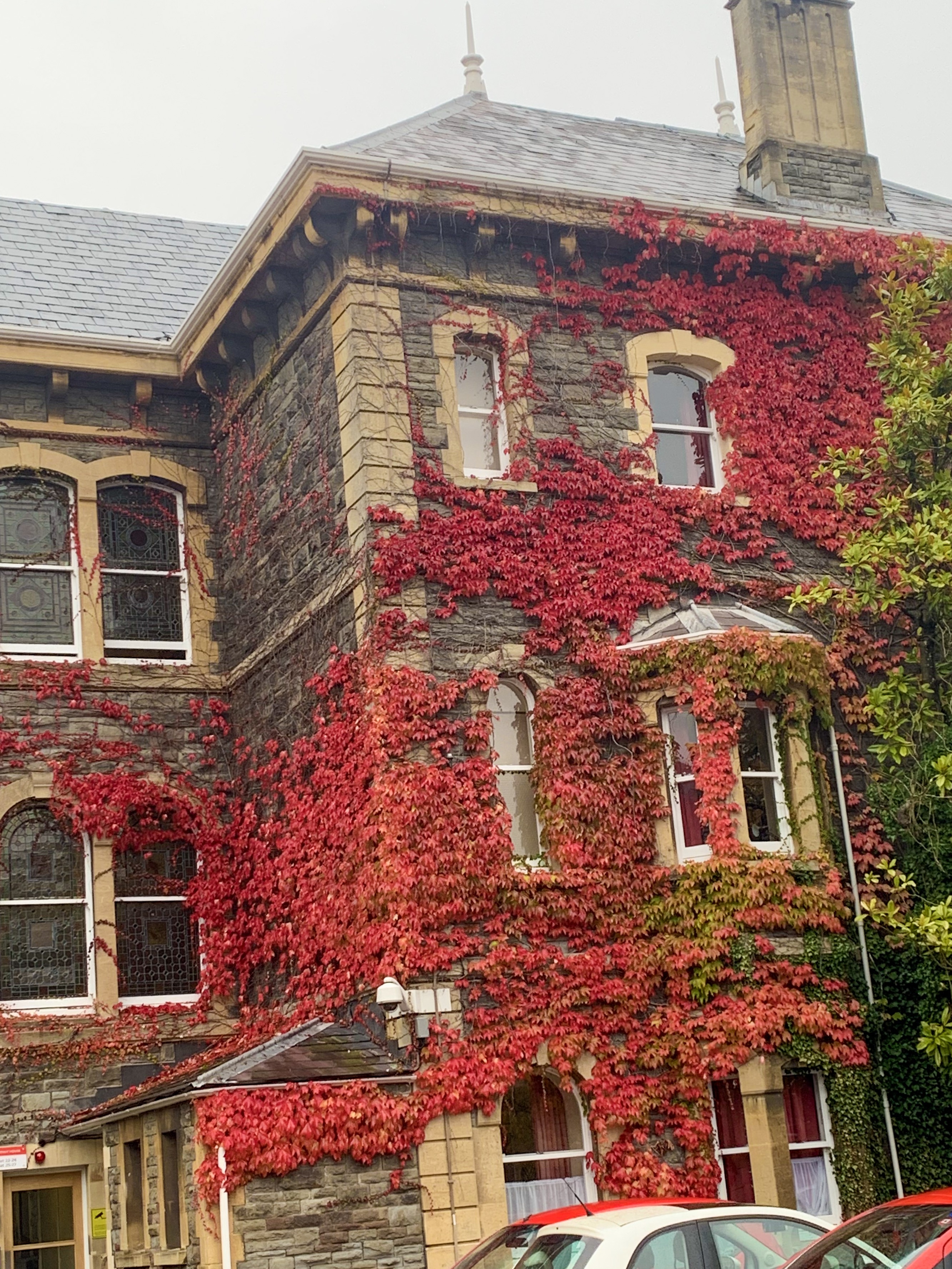 a car parked in front of a brick building