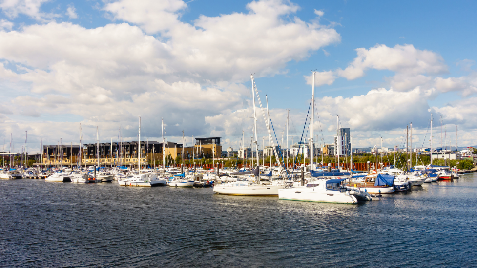 a boat is docked next to a body of water