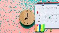 a clock next to a calendar