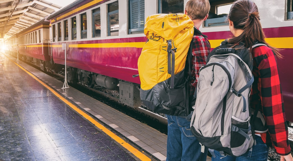 a person waiting for a train at a train station