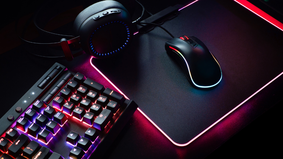 a desk with a computer mouse and keyboard