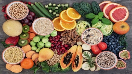 a group of fruit and vegetables on display