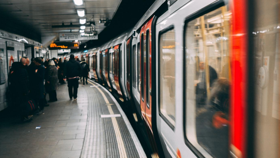 a passenger train pulling into a station