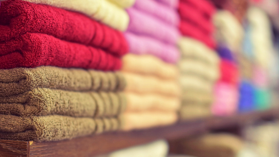 a close up of different coloured towels