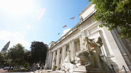 a statue of a man in front of a building