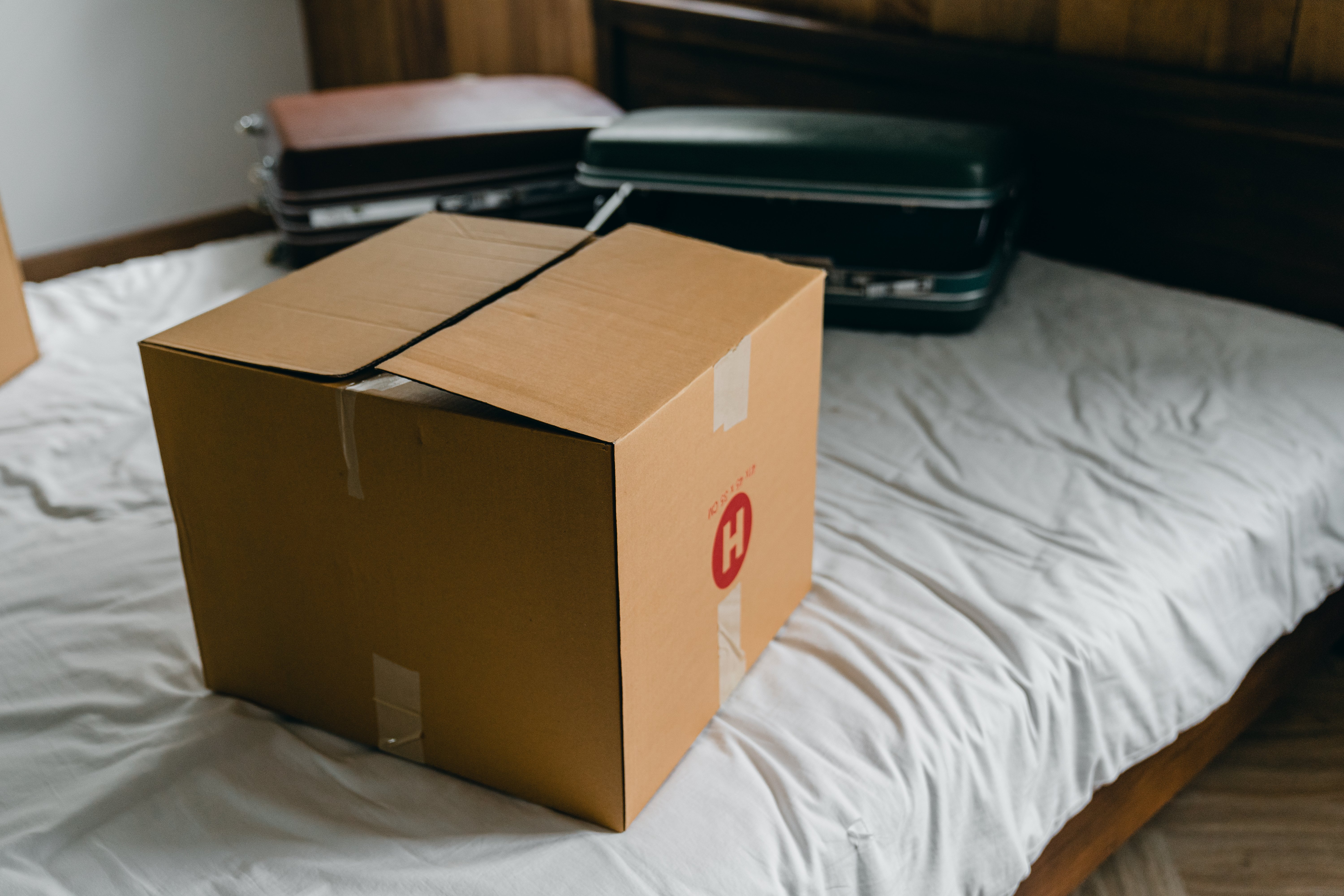 a box sitting on top of a bed