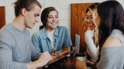 four young people socialising