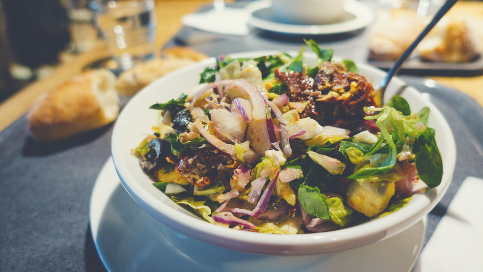 a close up of a bowl of salad