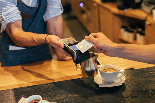 a person buying a coffee