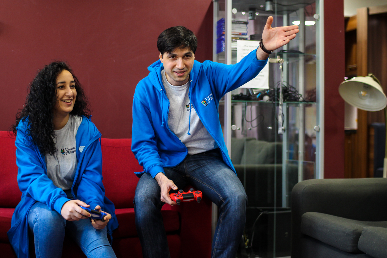 Two Living Support Assistants playing playstation