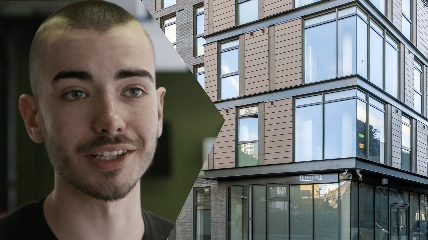 a man standing in front of a building