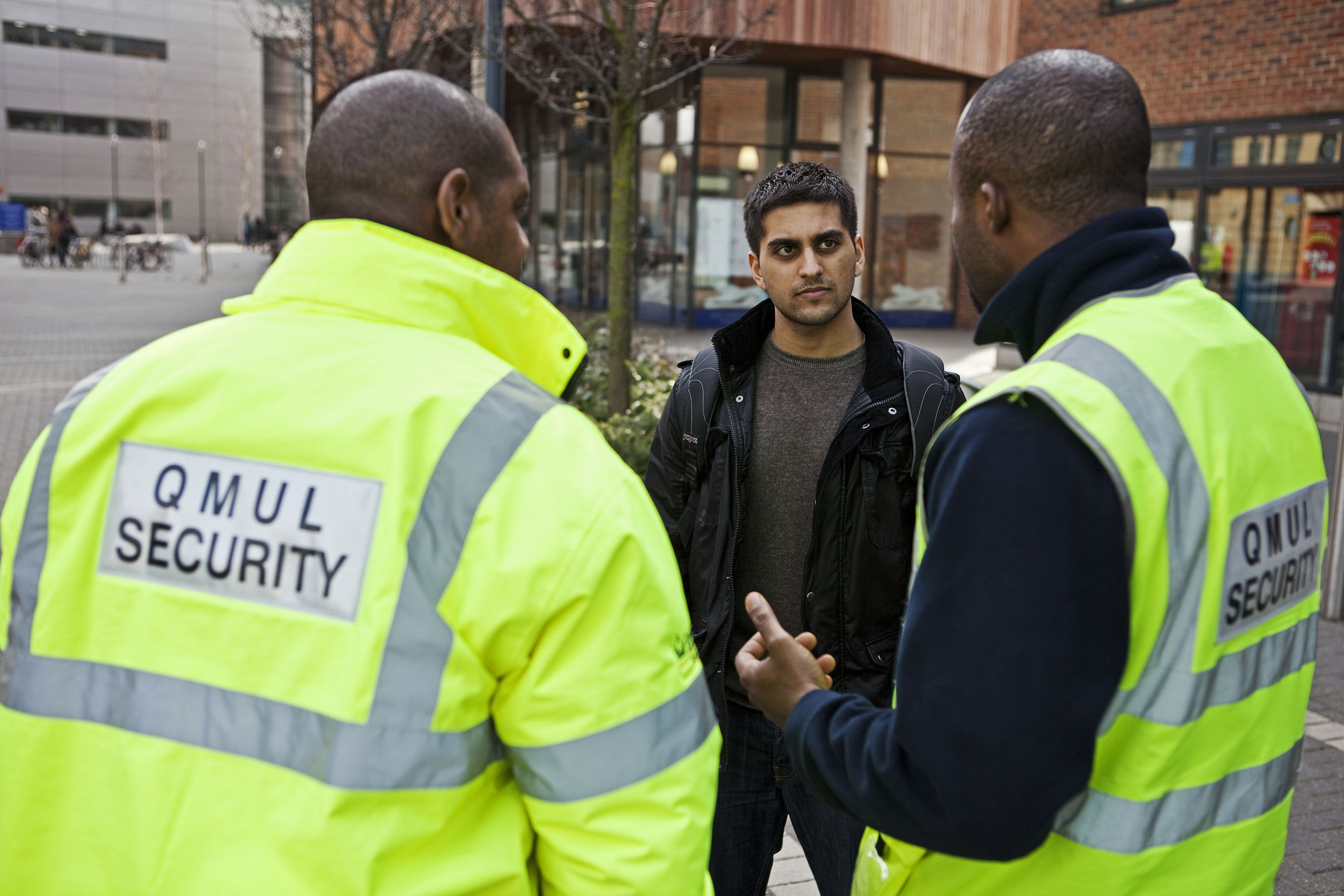 security team talking to a student