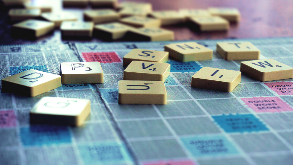 a close up of a scrabble board